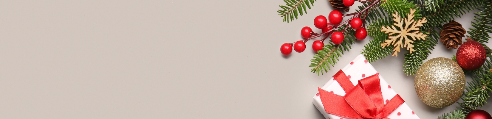 holiday present with greenery and ornaments